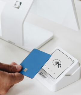 Close-up of a hand holding a credit card.
